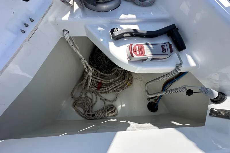 Best Day Ever Yacht Photos Pics Storage compartment on Jeanneau Sun Odyssey 410 sailboat, featuring ropes and control device.