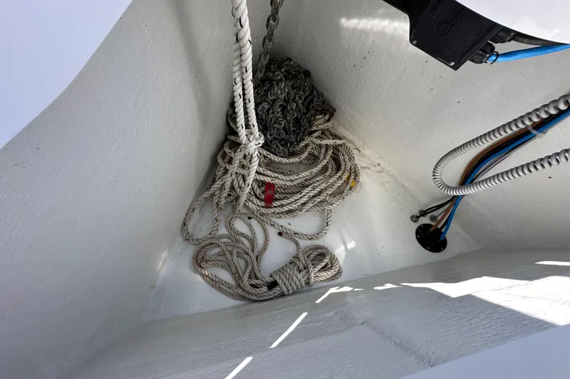 Best Day Ever Yacht Photos Pics Anchor locker of 2022 Jeanneau Sun Odyssey 410 with ropes and cables.