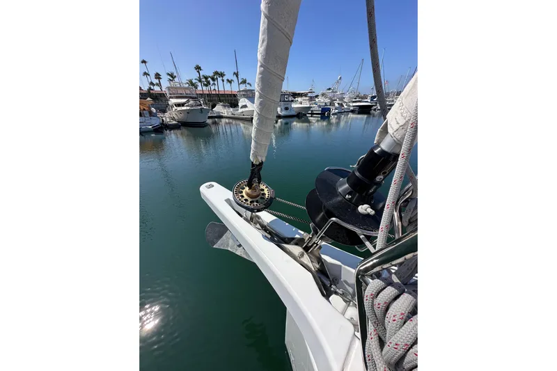Best Day Ever Yacht Photos Pics Jeanneau Sun Odyssey 410 sailboat docked in marina, 2022 model, with clear blue sky.