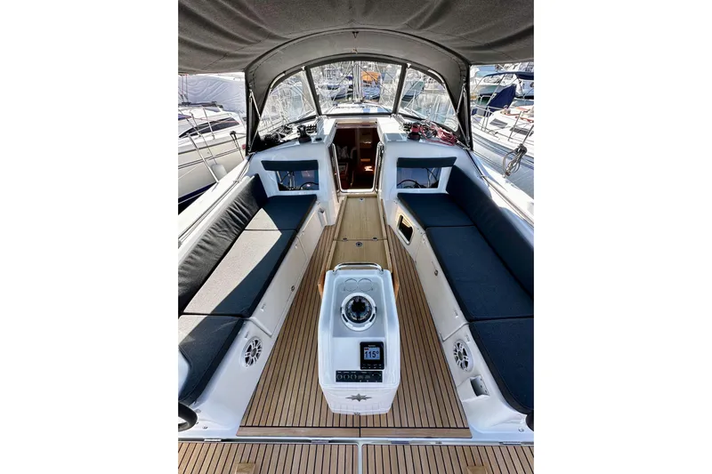 Best Day Ever Yacht Photos Pics 2022 Jeanneau Sun Odyssey 410 yacht cockpit with sleek seating and modern navigation equipment.