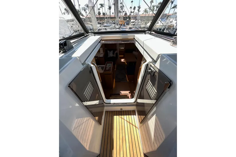 Best Day Ever Yacht Photos Pics Interior view of 2022 Jeanneau Sun Odyssey 410 sailboat, showcasing cabin entrance and deck.