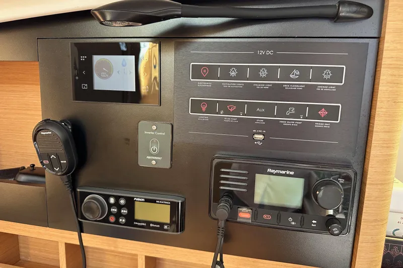 Best Day Ever Yacht Photos Pics Control panel of 2022 Jeanneau Sun Odyssey 410 yacht with navigation and communication systems.