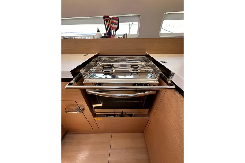 Best Day Ever Yacht Photos Pics Modern kitchen in 2022 Jeanneau Sun Odyssey 410 yacht with sleek stove and oven.