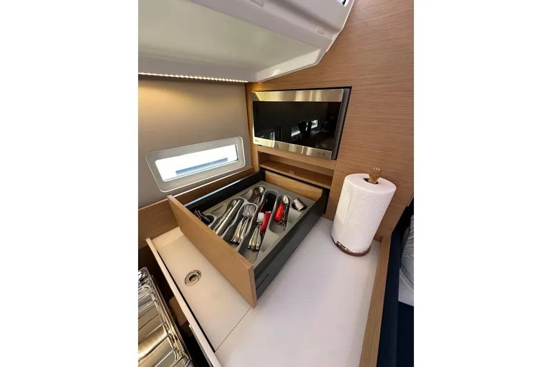 Best Day Ever Yacht Photos Pics Interior of 2022 Jeanneau Sun Odyssey 410 yacht with cutlery drawer and paper towel holder.