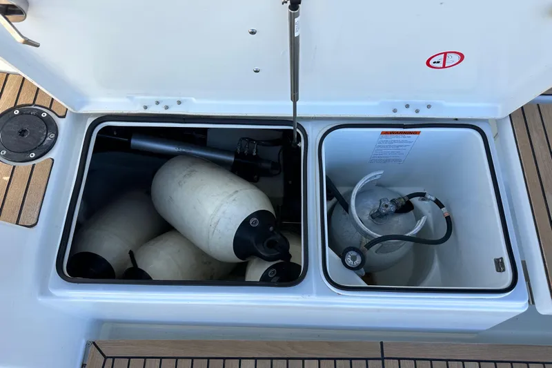 Best Day Ever Yacht Photos Pics Storage compartments on a 2022 Jeanneau Sun Odyssey 410 sailboat deck.