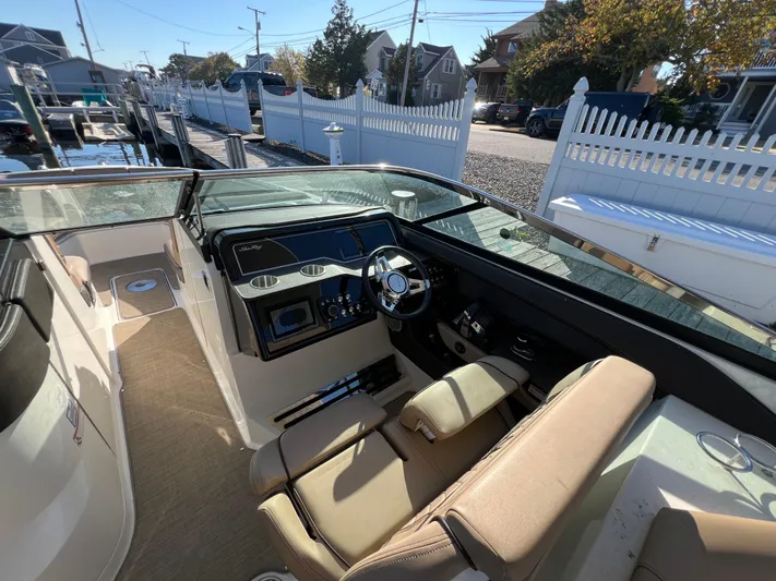 Knot On Call Yacht Photos Pics 2018 Sea Ray 310 SLX boat interior with beige seating and modern dashboard.