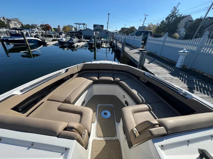 Knot On Call Yacht Photos Pics 2018 Sea Ray 310 SLX boat with spacious seating at a marina dock.