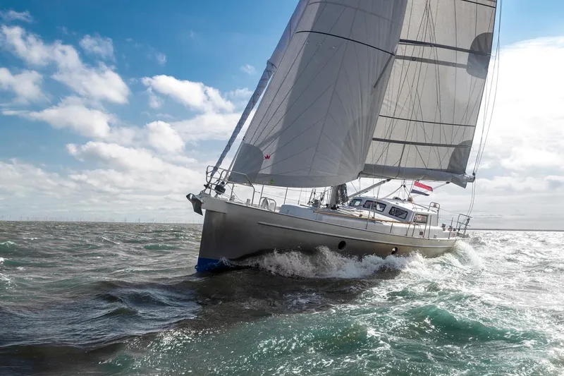 Bv3 Yacht Photos Pics Sailing yacht Bestevaer 36, 2023 model, navigating through ocean waves under a clear sky.