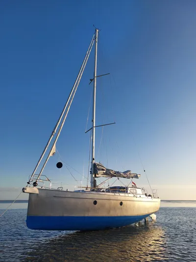 Bv3 Yacht Photos Pics 2023 Bestevaer 36 sailboat on calm water under clear blue sky.