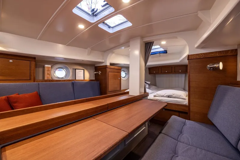 Bv3 Yacht Photos Pics Luxurious interior of 2023 Bestevaer 36 yacht with wooden finishes and cozy seating.