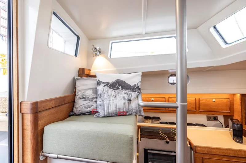 Bv3 Yacht Photos Pics Cozy interior of 2023 Bestevaer 36 yacht with cushions and wooden cabinetry.