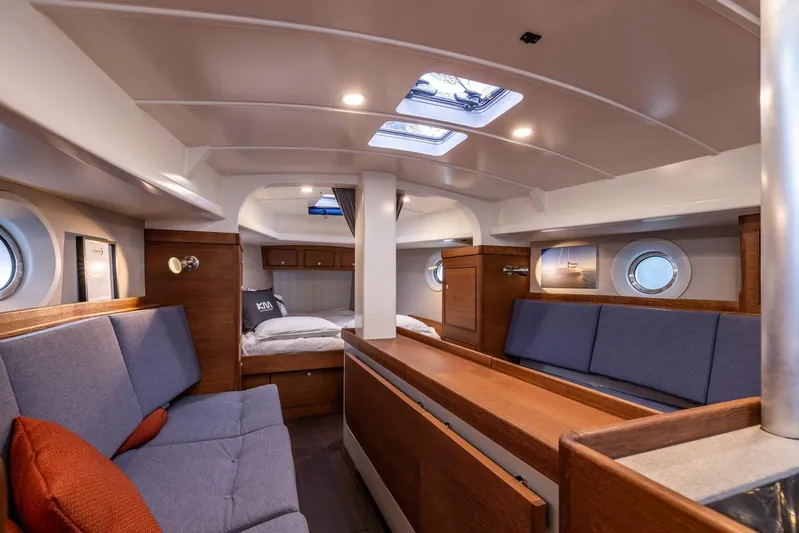 Bv3 Yacht Photos Pics Interior of 2023 Bestevaer 36 yacht, featuring cozy seating and elegant wood finishes.