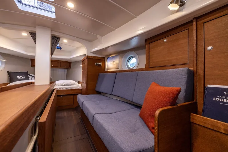 Bv3 Yacht Photos Pics Interior of 2023 Bestevaer 36 yacht with cozy seating and wooden cabinetry.
