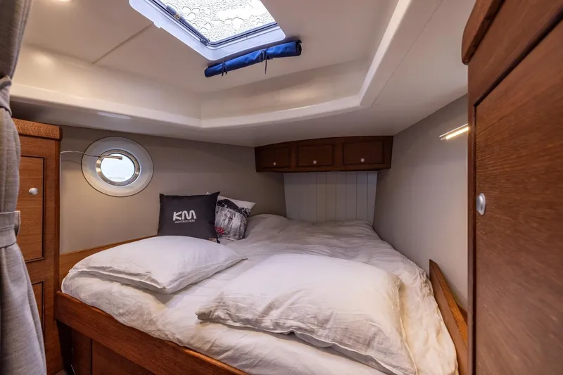 Bv3 Yacht Photos Pics Cozy cabin interior of 2023 Bestevaer 36 yacht with skylight and wooden furnishings.