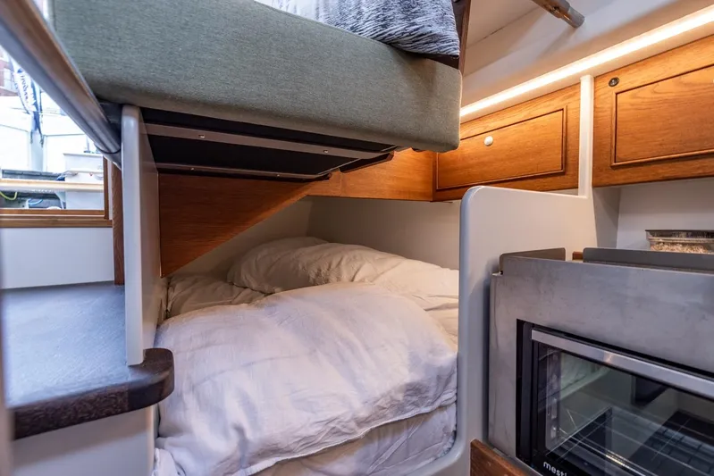 Bv3 Yacht Photos Pics Cozy cabin interior of 2023 Bestevaer 36 yacht with bed and wooden cabinetry.