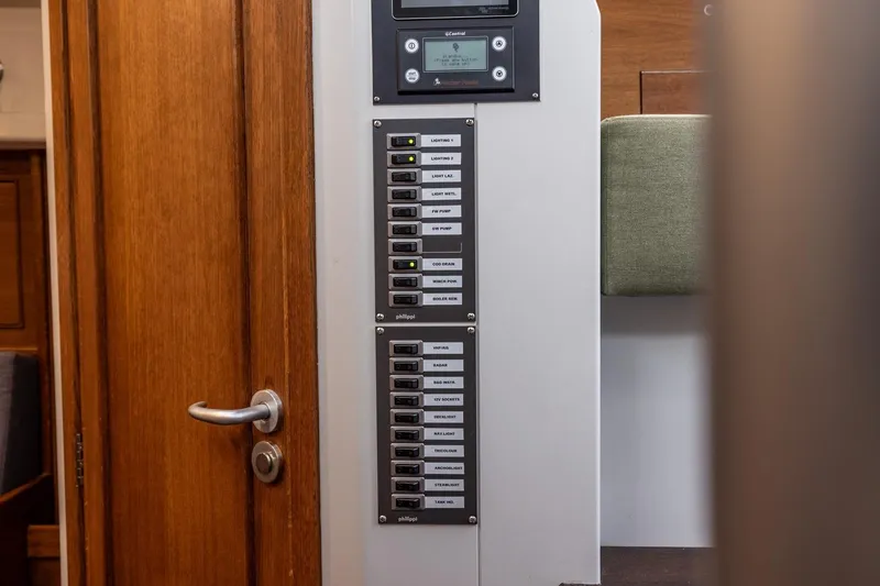 Bv3 Yacht Photos Pics Electrical panel inside 2023 Bestevaer 36 yacht, featuring labeled switches and control display.