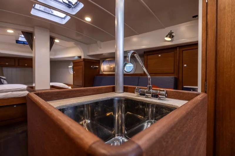 Bv3 Yacht Photos Pics Interior of 2023 Bestevaer 36 yacht, featuring a modern sink and wooden cabinetry.
