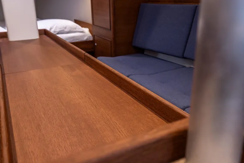 Bv3 Yacht Photos Pics Interior of 2023 Bestevaer 36 yacht with wooden table and blue seating.