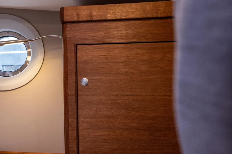 Bv3 Yacht Photos Pics Wooden cabinet and porthole inside 2023 Bestevaer 36 yacht interior.