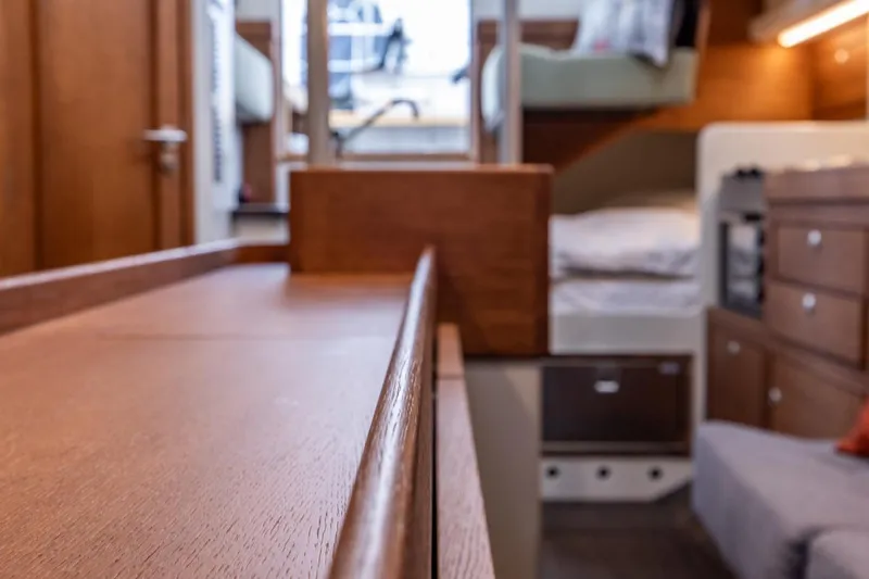 Bv3 Yacht Photos Pics Interior of 2023 Bestevaer 36 yacht, featuring wooden cabinetry and cozy sleeping area.