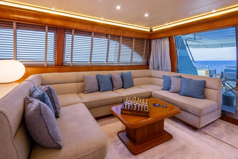  Yacht Photos Pics Luxurious interior of 2003 Canados 86 yacht with plush seating and chessboard.
