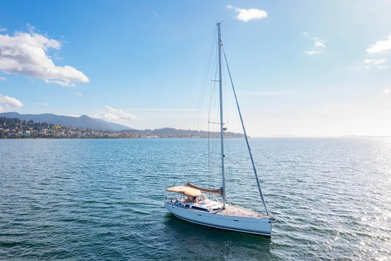La Chiricana Yacht Photos Pics Sailing yacht Dufour 525 Grand Large 2011 on serene waters under a clear sky.