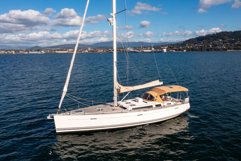 La Chiricana Yacht Photos Pics Sailing yacht Dufour 525 Grand Large 2011 on open water, clear sky background.