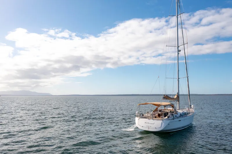 La Chiricana Yacht Photos Pics Sailing yacht Dufour 525 Grand Large 2011 on open sea under blue sky.