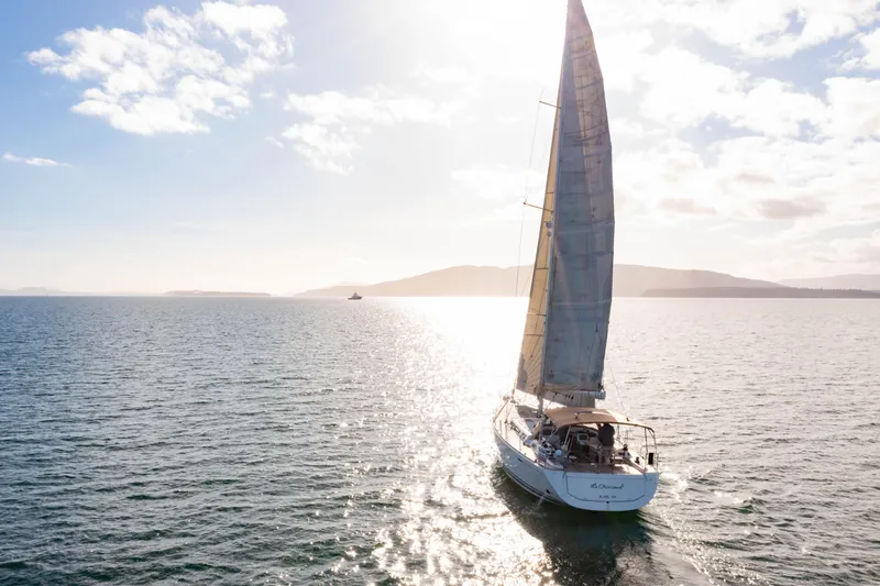 La Chiricana Yacht Photos Pics Sailing yacht Dufour 525 Grand Large 2011 on open sea under sunny sky.