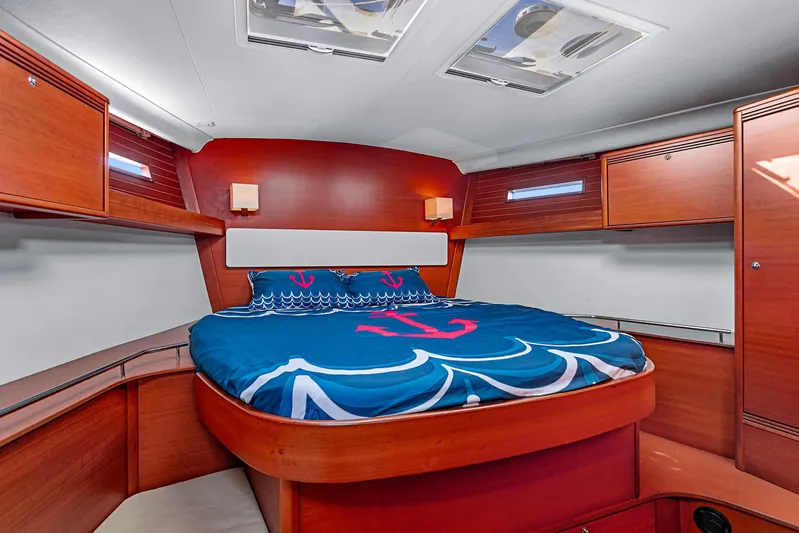 La Chiricana Yacht Photos Pics Luxurious cabin interior of 2011 Dufour 525 Grand Large yacht with nautical bedding.