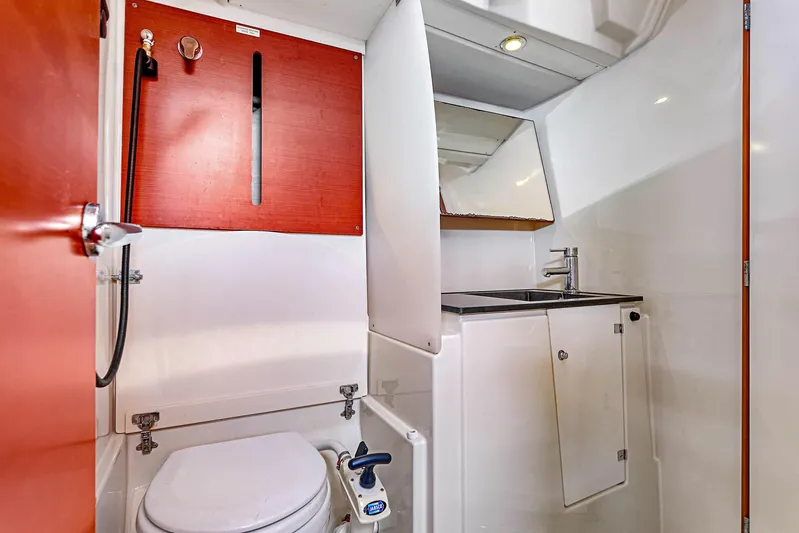 La Chiricana Yacht Photos Pics Bathroom interior of 2011 Dufour 525 Grand Large yacht, featuring toilet and sink.