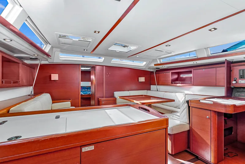 La Chiricana Yacht Photos Pics Luxurious interior of 2011 Dufour 525 Grand Large yacht with elegant wood finish and skylights.