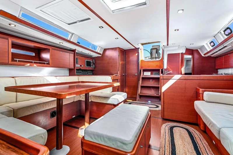La Chiricana Yacht Photos Pics Luxurious interior of 2011 Dufour 525 Grand Large yacht with elegant wood finish.