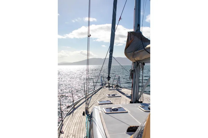 La Chiricana Yacht Photos Pics Sailing on a 2011 Dufour 525 Grand Large yacht, sunlit sea view.