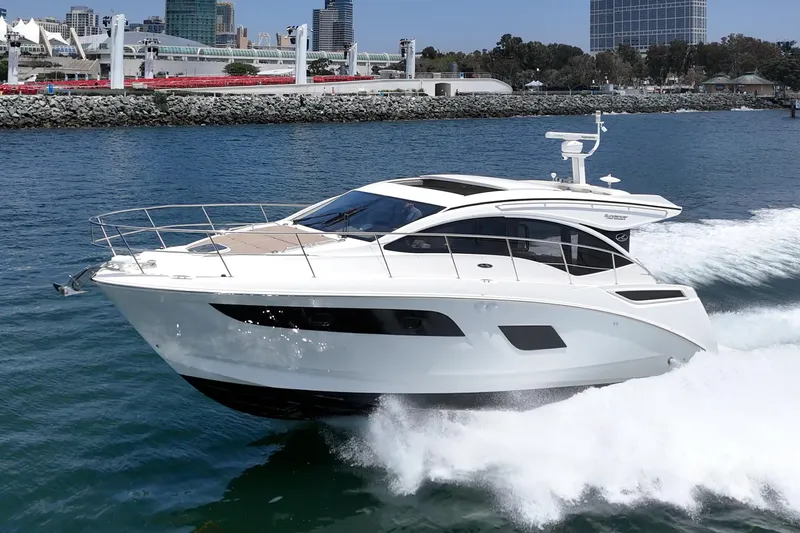  Yacht Photos Pics 2017 Sea Ray Sundancer 400 yacht cruising on a sunny day near the coastline.