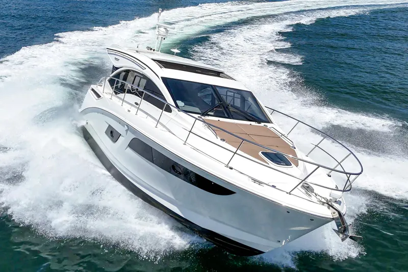  Yacht Photos Pics 2017 Sea Ray Sundancer 400 yacht cruising on open water, creating a dynamic wake.