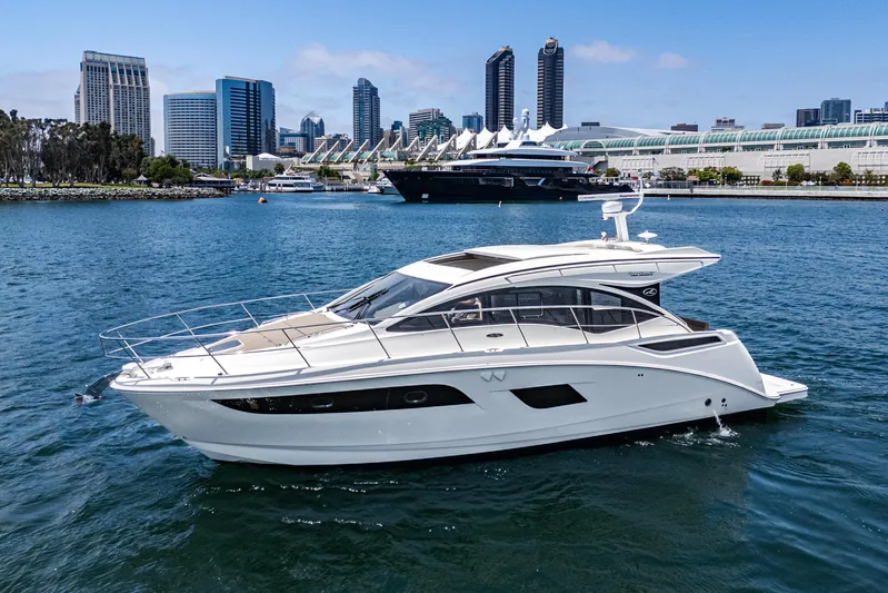  Yacht Photos Pics 2017 Sea Ray Sundancer 400 yacht cruising in urban waterfront setting.