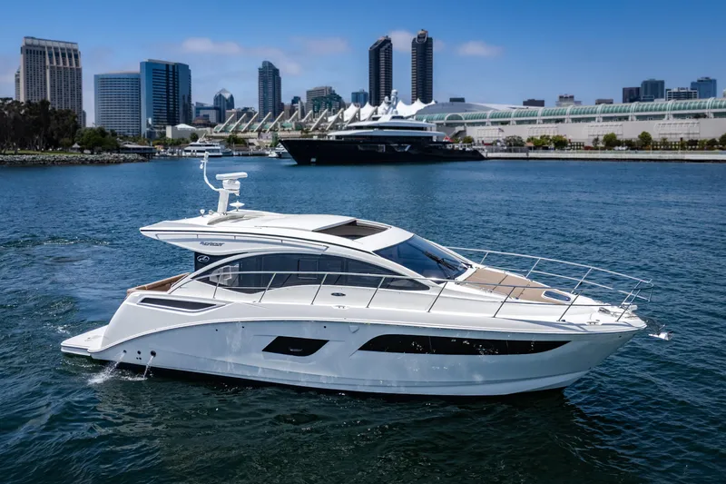  Yacht Photos Pics 2017 Sea Ray Sundancer 400 yacht cruising in urban waterfront setting.