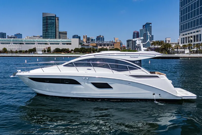 Yacht Photos Pics 2017 Sea Ray Sundancer 400 yacht cruising in urban waterfront setting.