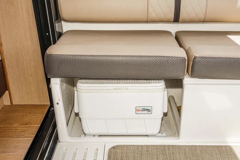  Yacht Photos Pics 2017 Sea Ray Sundancer 400 interior with cushioned seating and built-in storage compartment.