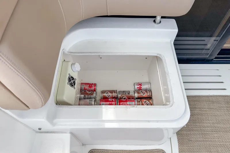  Yacht Photos Pics Built-in cooler with soda cans on a 2017 Sea Ray Sundancer 400 boat.