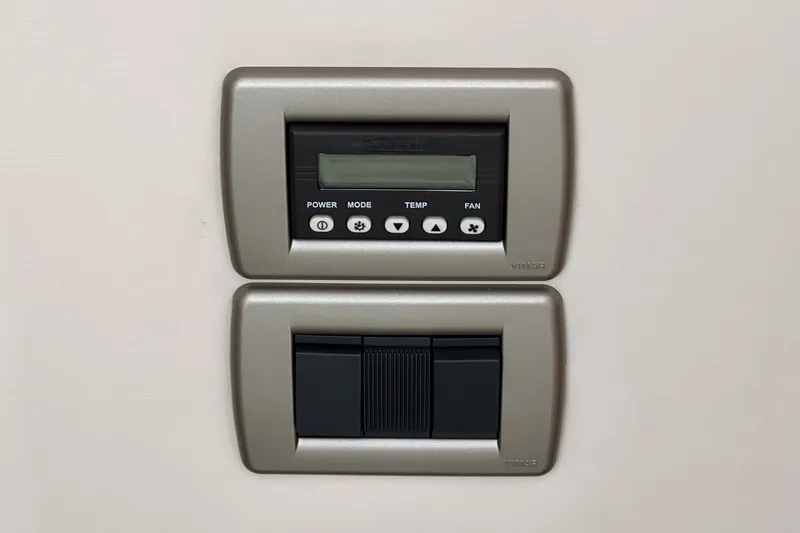  Yacht Photos Pics Control panel on a 2017 Sea Ray Sundancer 400 yacht, featuring buttons and display.