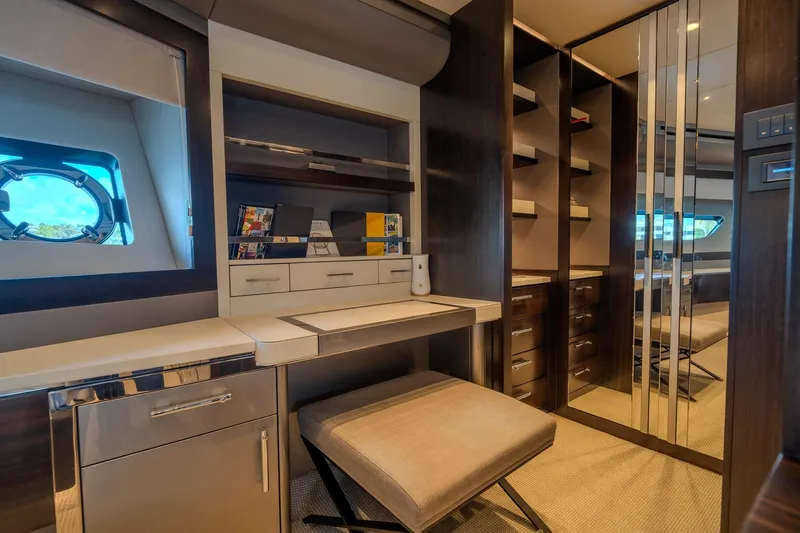 Ramaya 4 Yacht Photos Pics Luxurious interior of 2023 Sunseeker 88 Yacht with elegant desk and storage.