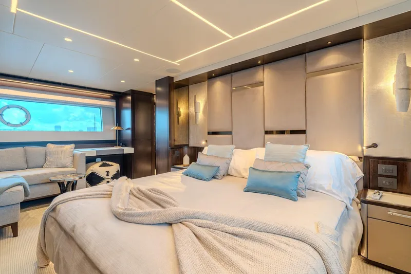 Ramaya 4 Yacht Photos Pics Luxurious bedroom interior of 2023 Sunseeker 88 Yacht with elegant decor and modern furnishings.