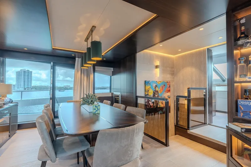 Ramaya 4 Yacht Photos Pics Luxurious interior of 2023 Sunseeker 88 Yacht with elegant dining area and modern decor.