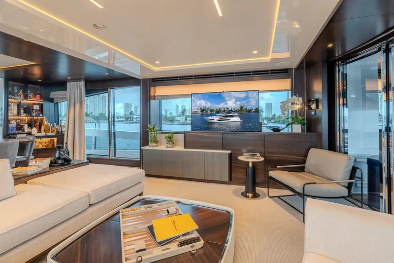 Ramaya 4 Yacht Photos Pics Luxurious interior of 2023 Sunseeker 88 Yacht with modern furnishings and city view.