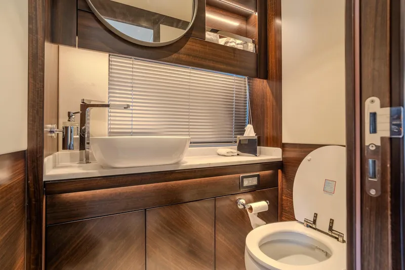 Ramaya 4 Yacht Photos Pics Luxurious bathroom in 2023 Sunseeker 88 Yacht with modern fixtures and elegant wood finishes.