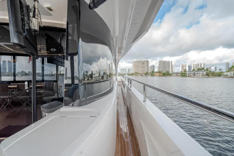 Ramaya 4 Yacht Photos Pics 2023 Sunseeker 88 Yacht deck with city skyline and waterfront view.