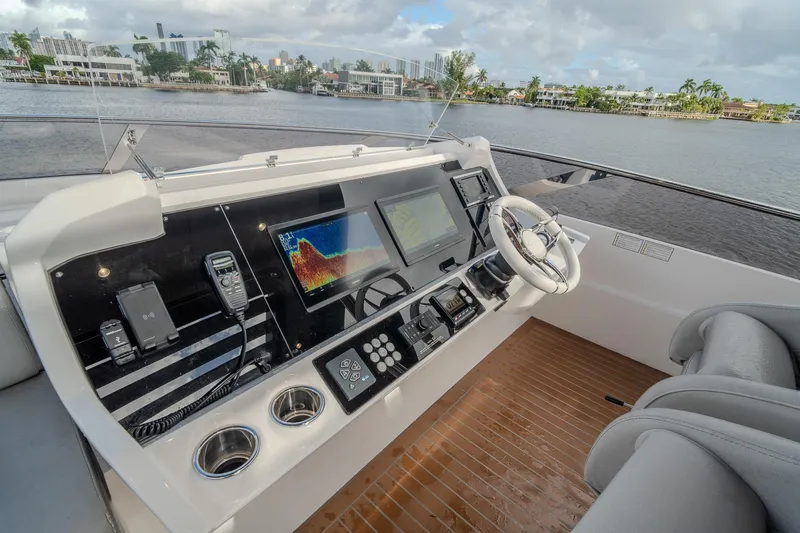 Ramaya 4 Yacht Photos Pics Helm of 2023 Sunseeker 88 Yacht with modern navigation equipment and luxurious seating.