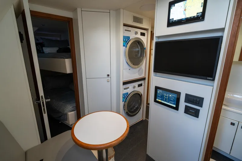 Ramaya 4 Yacht Photos Pics Interior of 2023 Sunseeker 88 Yacht featuring laundry appliances and modern control panels.